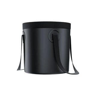 Black bucket bag of Green Lion Portable Camping Shower with a strap on a white background