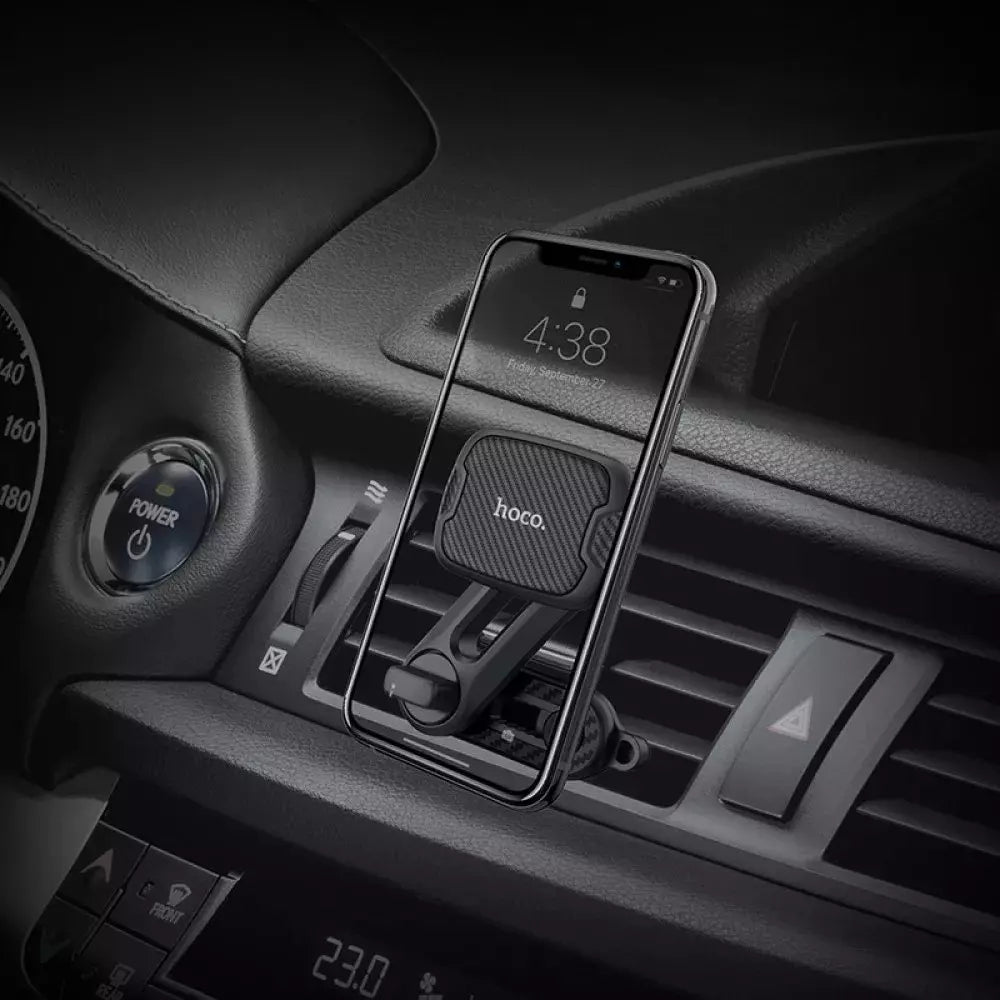 Hoco CA68 Sagittarius Series Magnetic Air Outlet Holder in a car with a phone mounted, showing easy access to the screen.