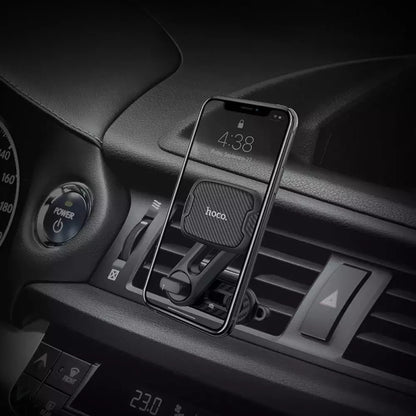 Hoco CA68 Sagittarius Series Magnetic Air Outlet Holder in a car with a phone mounted, showing easy access to the screen.