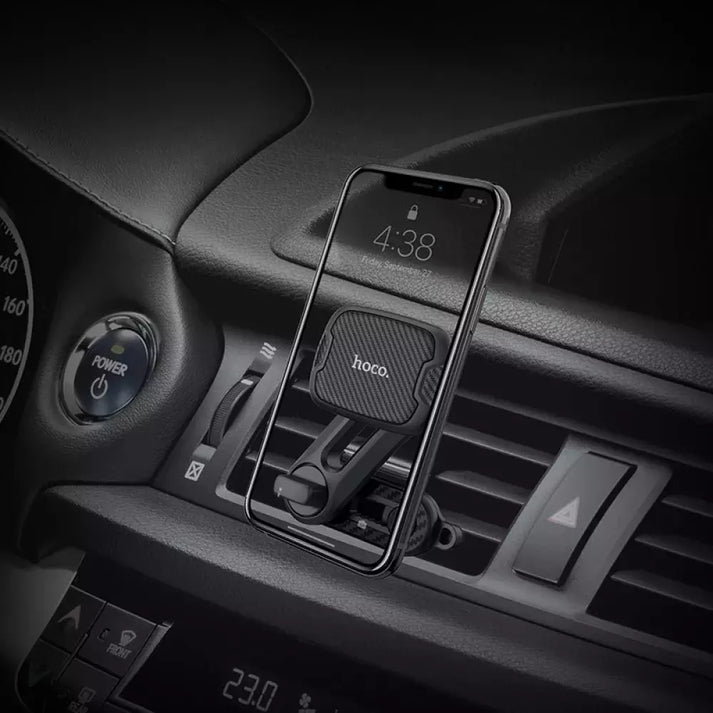 Hoco CA68 Sagittarius Series Magnetic Air Outlet Holder in a car with a phone mounted, showing easy access to the screen.